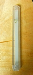 Clear with double sided tape and screw on bottom for easy removal of mezuzah: $6.00